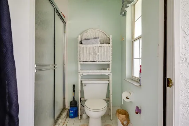 a bedroom with a bed and a tv