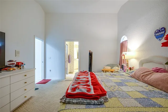 a spacious bathroom with a mirror and a shower