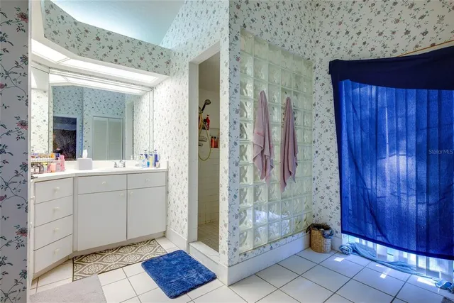 a view of walk in closet with clothes