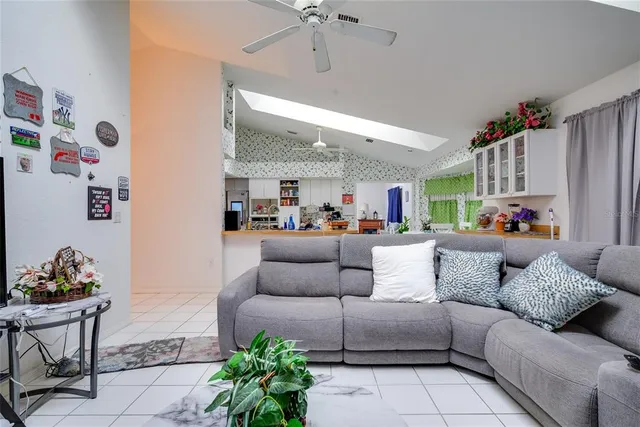 a view of a patio with dining table and chairs with plants