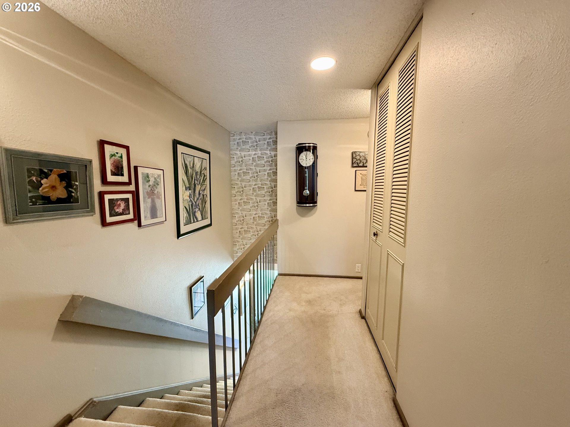 160 Westbrook Way Eugene, OR 97405 - Photo 19 of 31 a view of a hallway with paintings on the wall