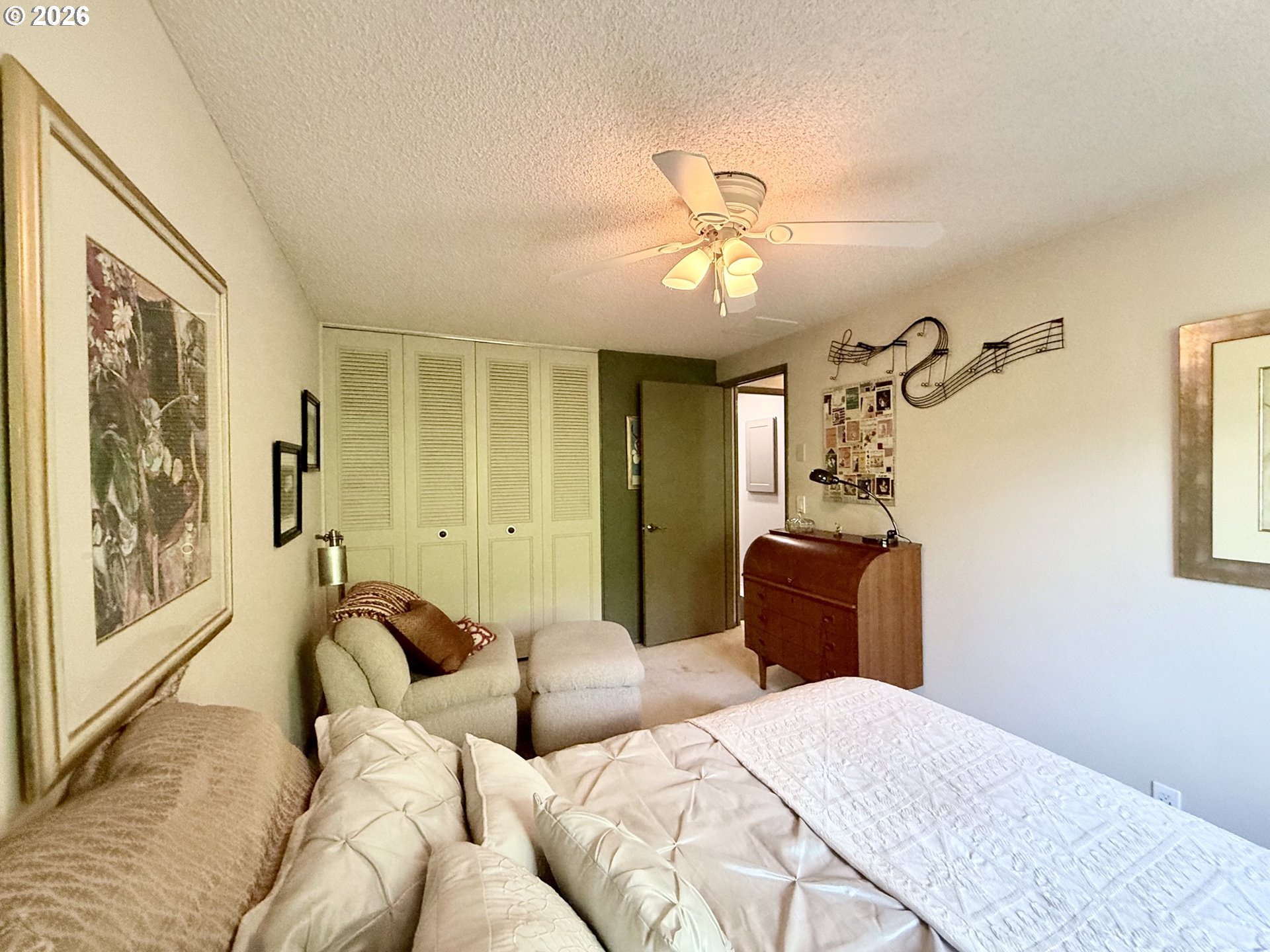 160 Westbrook Way Eugene, OR 97405 - Photo 21 of 31 a bedroom with a bed and wooden floor
