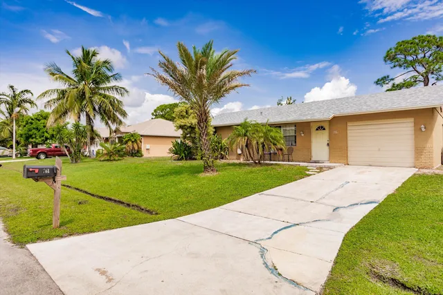 a view of a backyard with potted plants