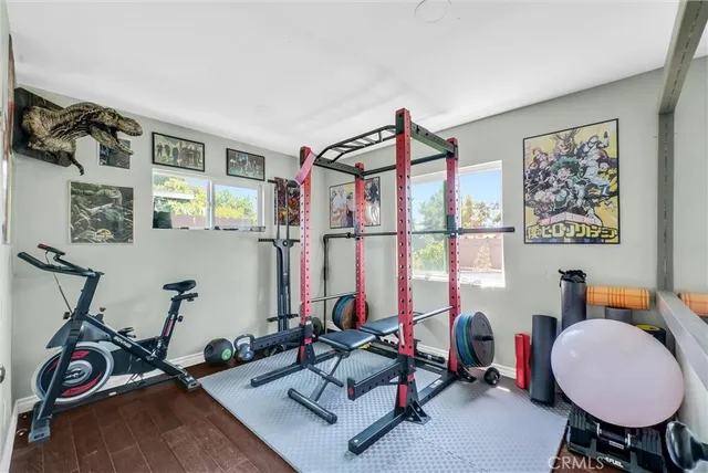 a room with gym equipment and view of living room