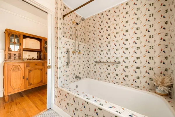 a bathroom with a bathtub and shower