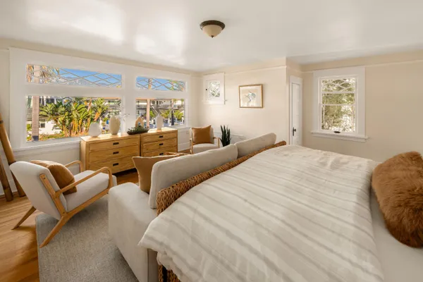 a bed room with two bed and a couch