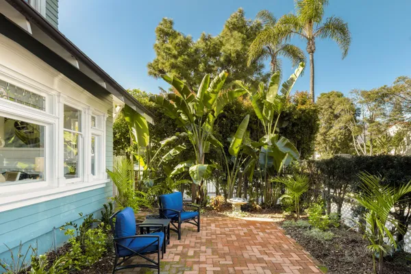a view of a backyard with sitting area