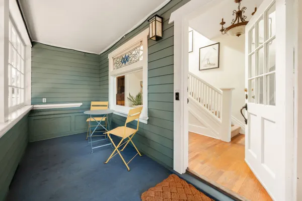a living room with a couch and a window