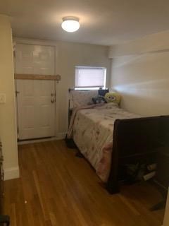 32 Edgerly Road, Unit B Boston, MA 02115 - Photo 2 of 4 a bed sitting in a room next to a window