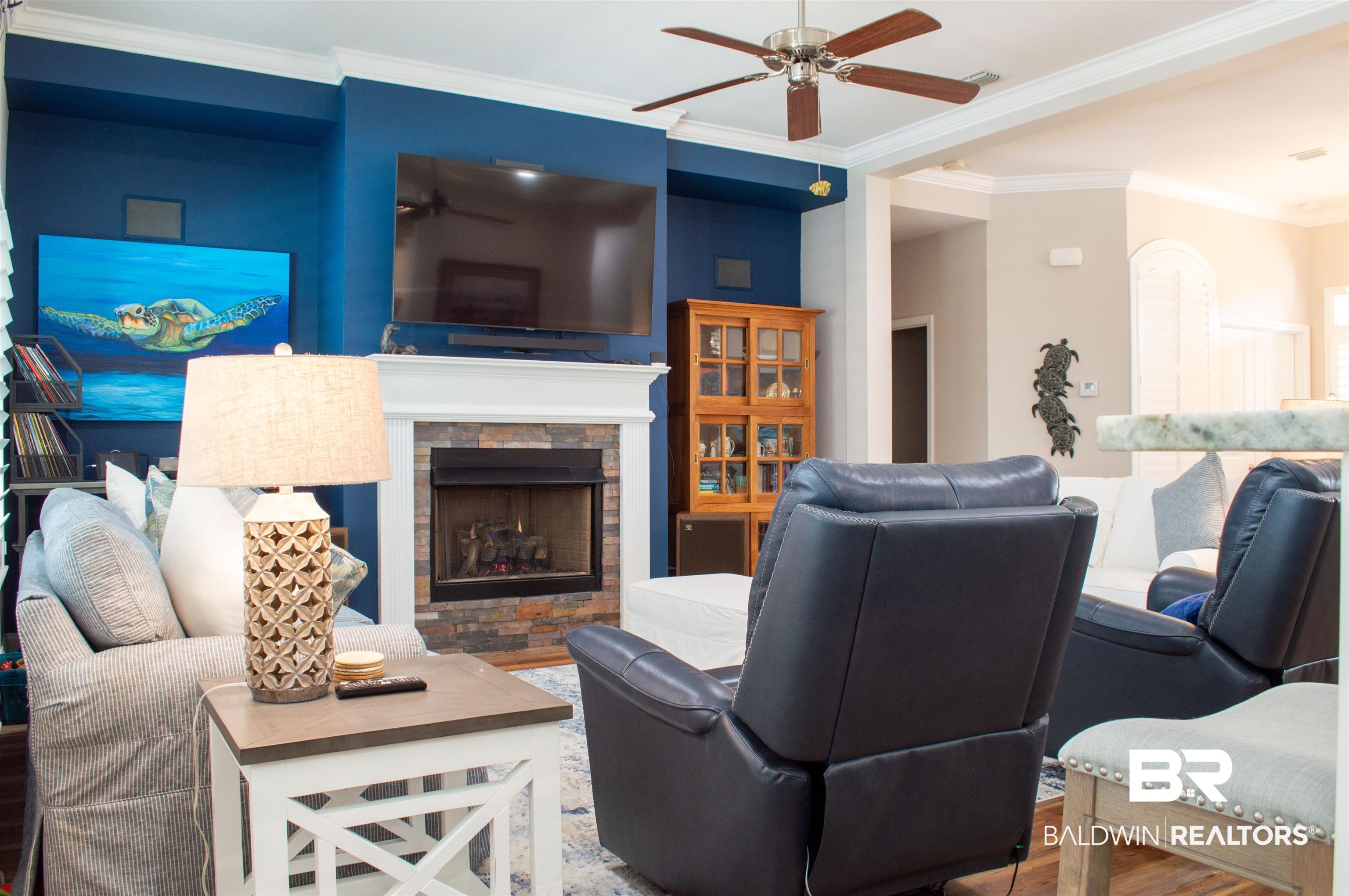 1124 West Orlando Drive Foley, AL 36535 - Photo 10 of 51 Living room with ornamental molding, a fireplace, wood finished floors, and ceiling fan