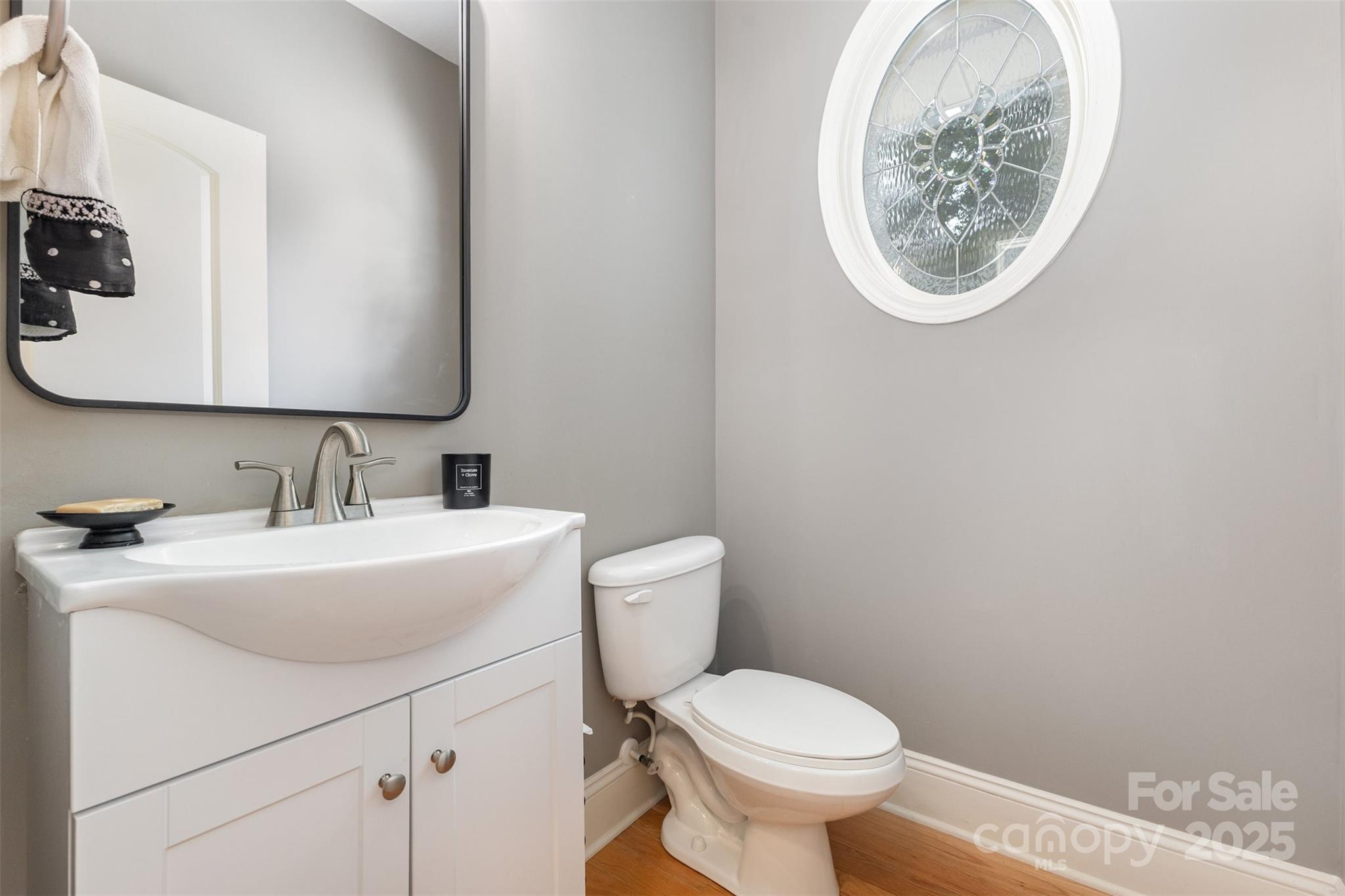 689 Presbyterian Road Mooresville, NC 28115 - Photo 14 of 34 a bathroom with a toilet sink and mirror