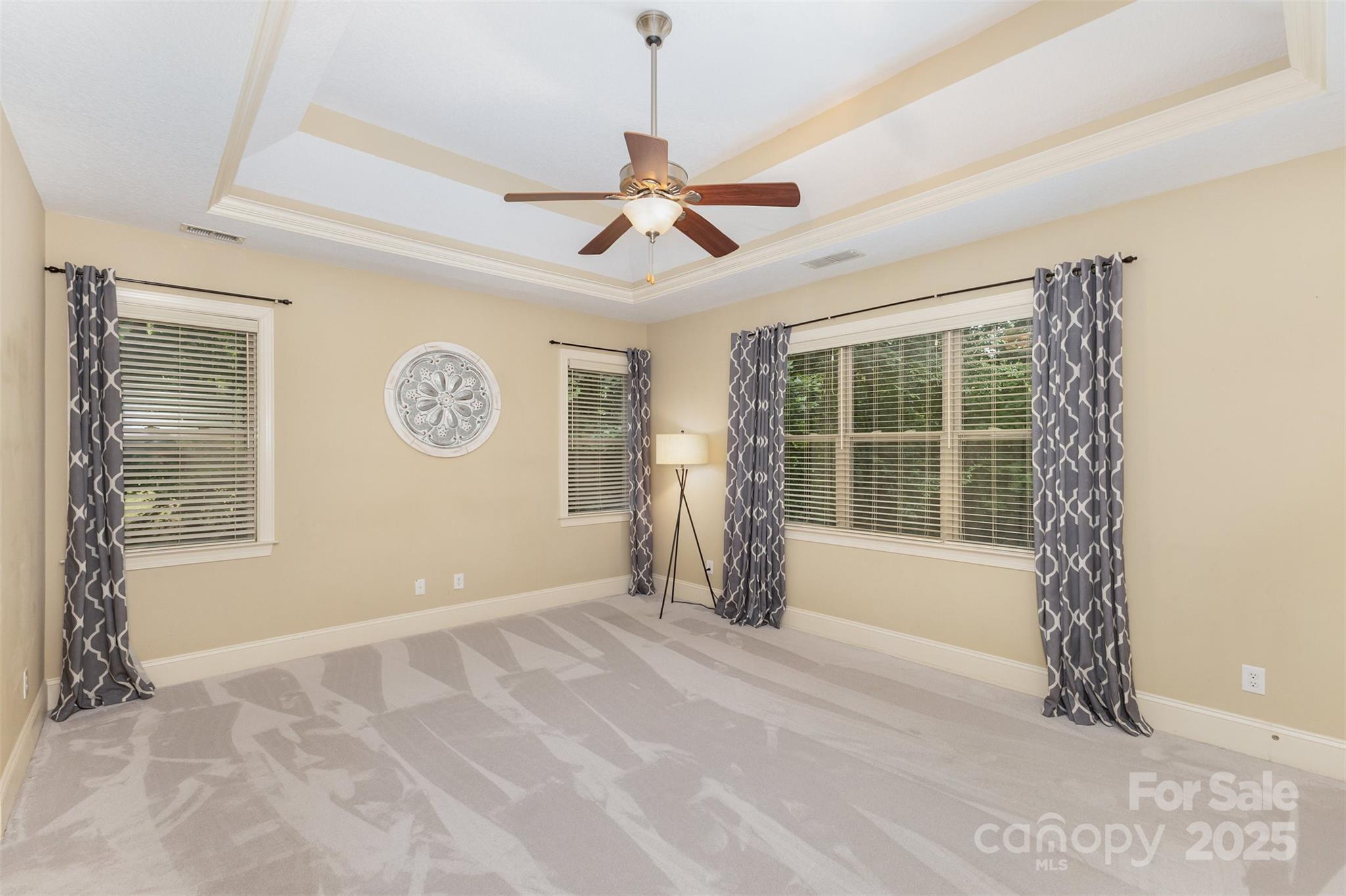 689 Presbyterian Road Mooresville, NC 28115 - Photo 17 of 34 a view of a livingroom with a chandelier fan and windows