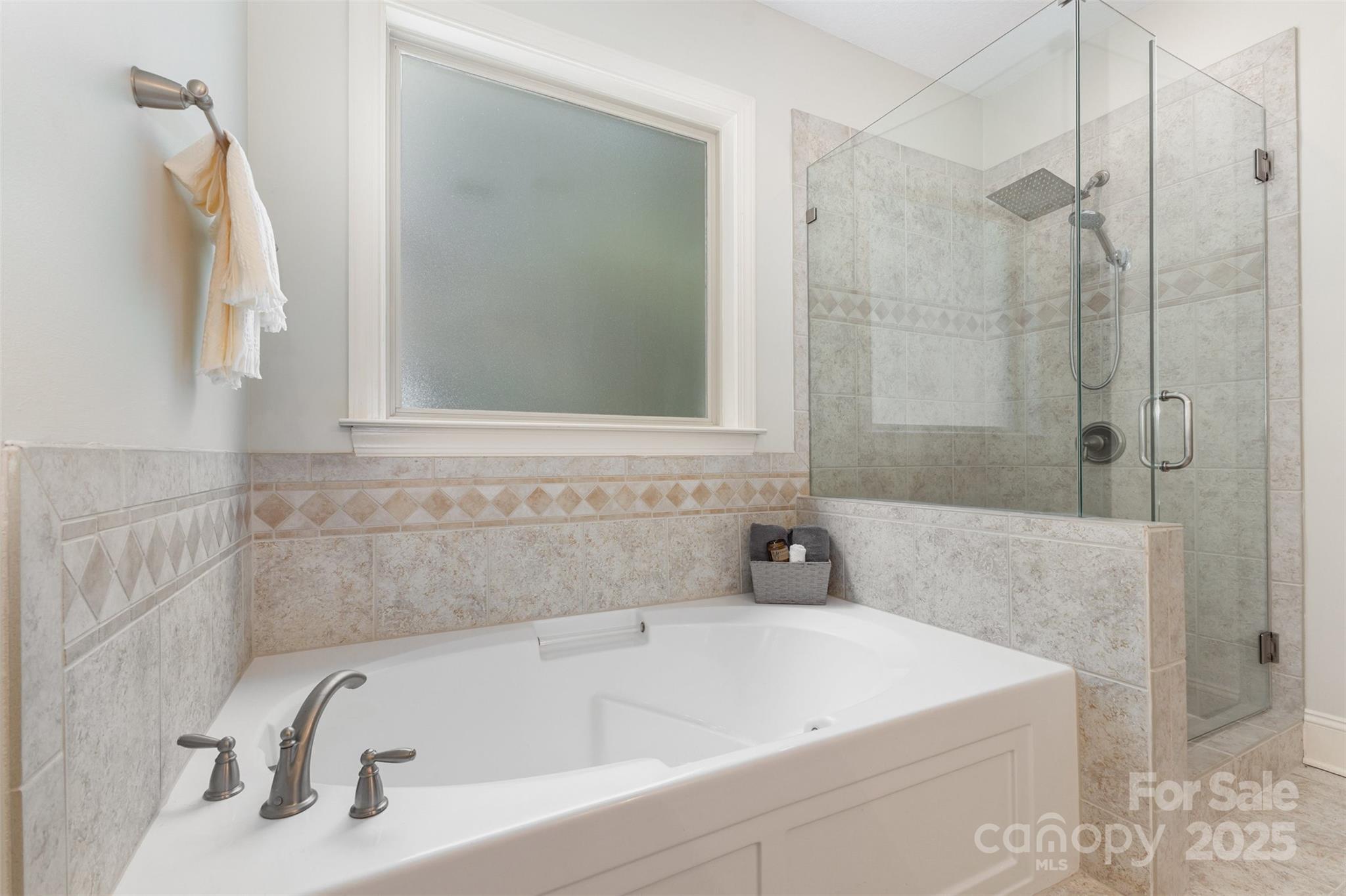689 Presbyterian Road Mooresville, NC 28115 - Photo 20 of 34 a bathroom with a tub a sink and a shower