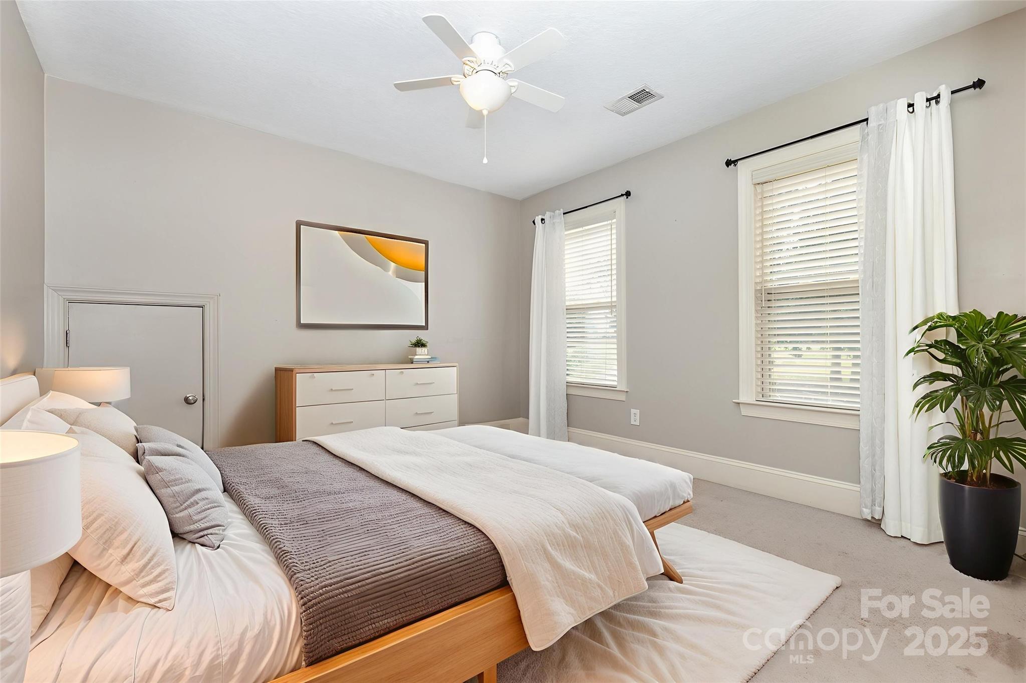689 Presbyterian Road Mooresville, NC 28115 - Photo 21 of 34 a bedroom with a bed and a potted plant
