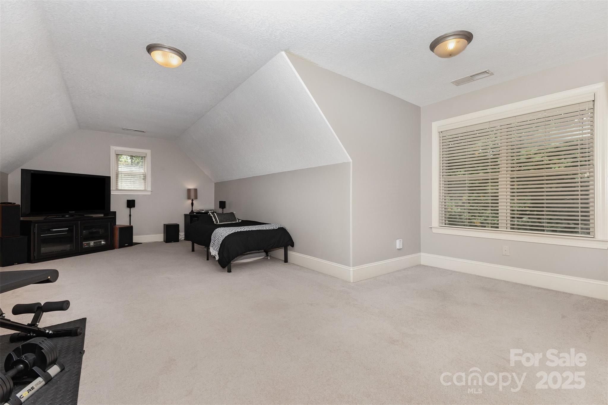 689 Presbyterian Road Mooresville, NC 28115 - Photo 26 of 34 a big room with windows and a flat screen tv