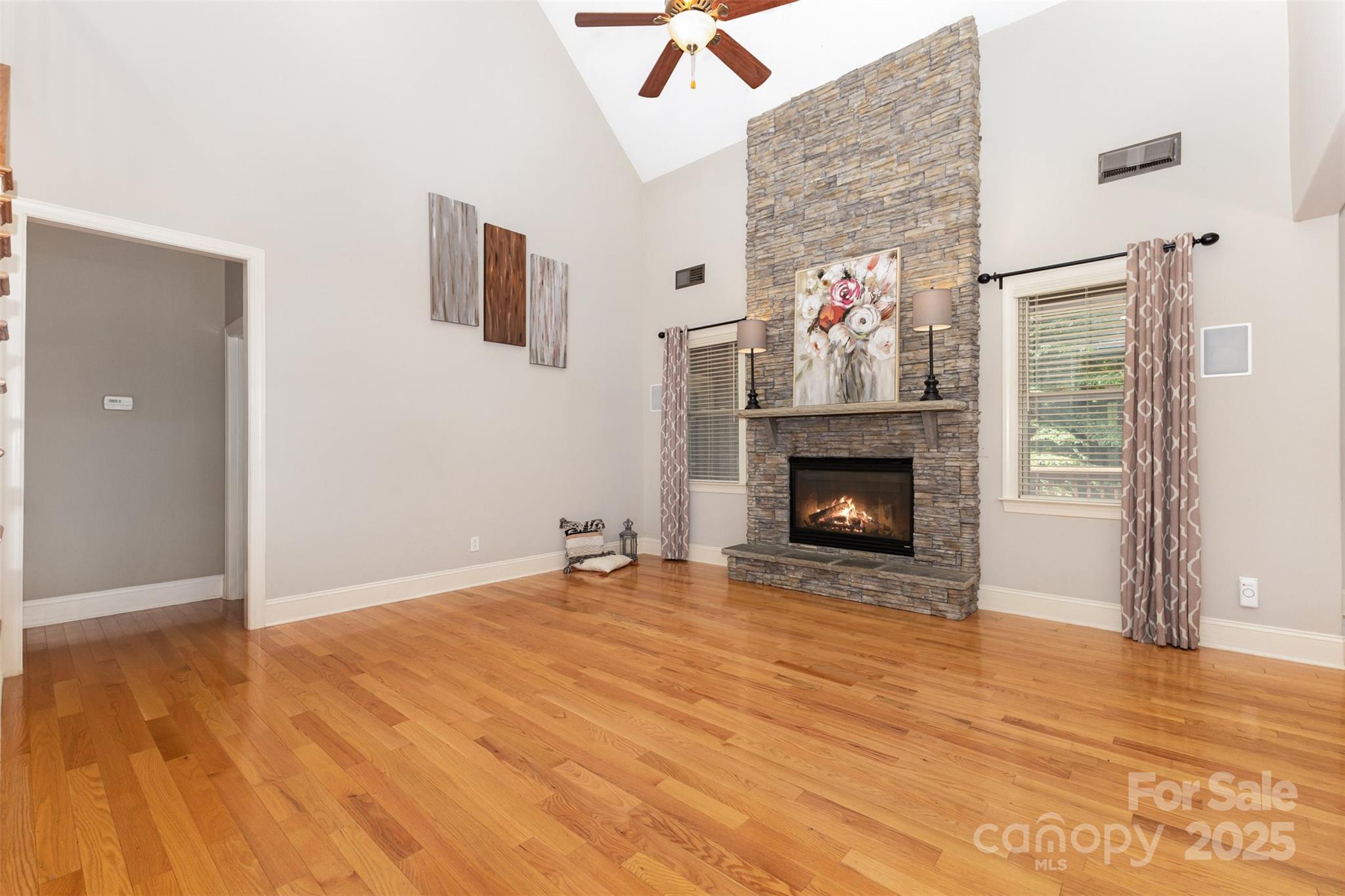 689 Presbyterian Road Mooresville, NC 28115 - Photo 5 of 34 a view of an empty room with wooden floor fireplace and a window