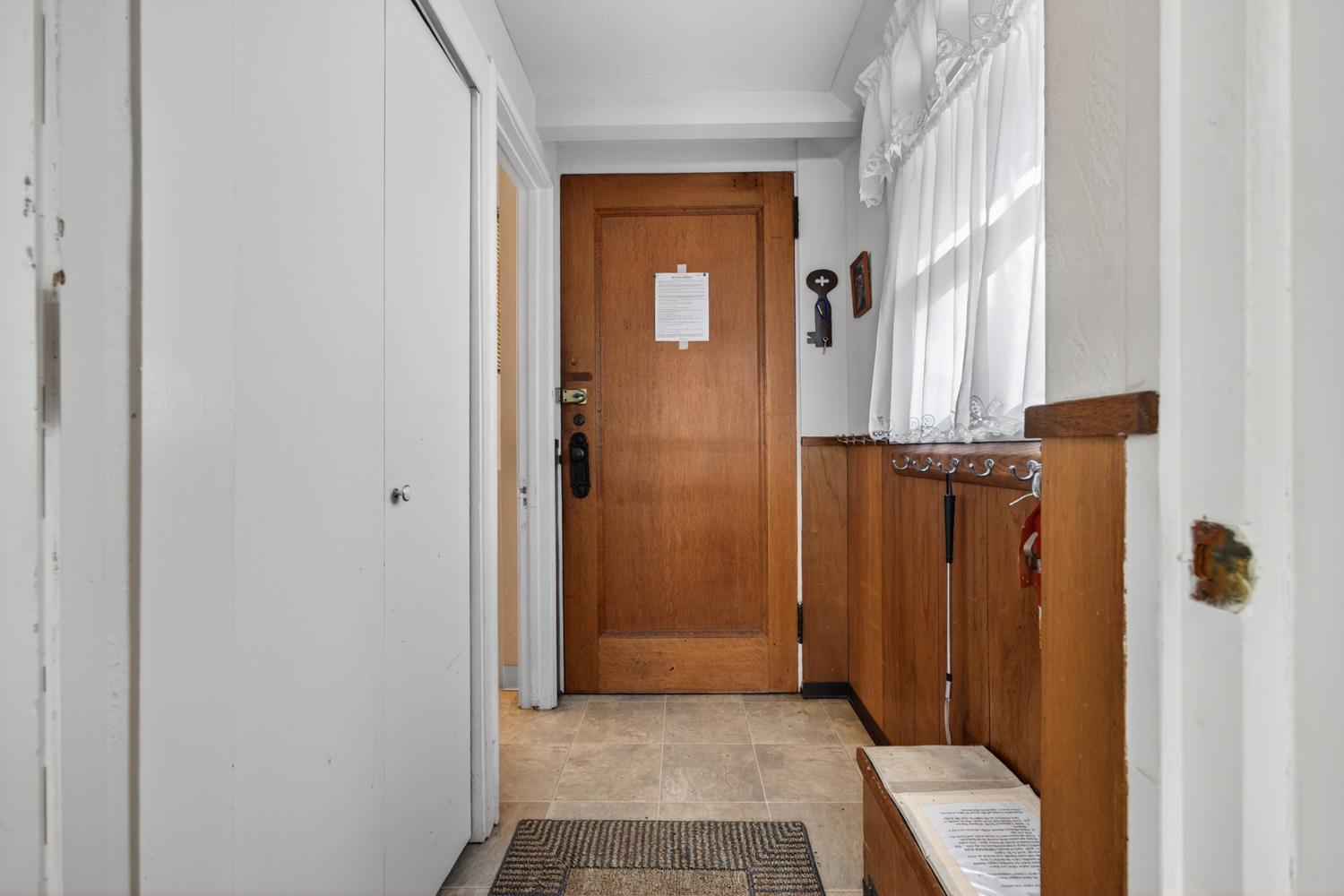 1224 Moran Road Arnold, CA 95223 - Photo 13 of 61 a view of a hallway with wooden floor and a bathroom