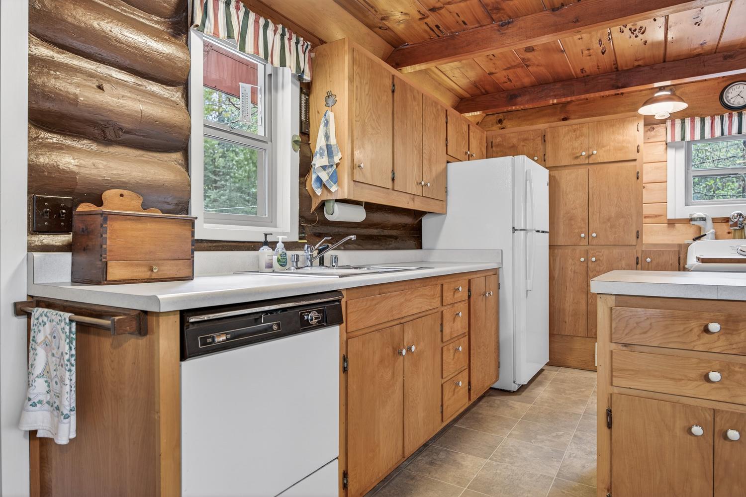 1224 Moran Road Arnold, CA 95223 - Photo 17 of 61 a kitchen with sink a refrigerator and cabinets