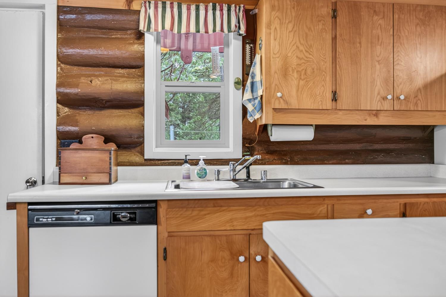 1224 Moran Road Arnold, CA 95223 - Photo 19 of 61 a kitchen with a sink cabinets and window