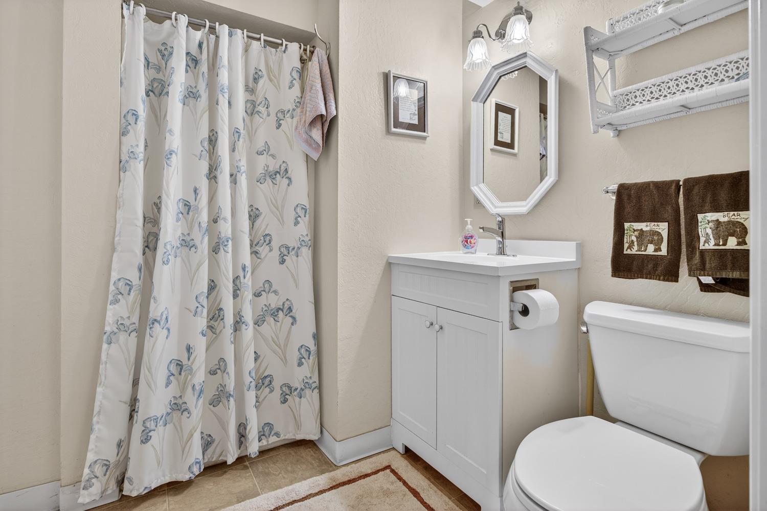 1224 Moran Road Arnold, CA 95223 - Photo 39 of 61 a white toilet sitting next to a bathroom sink