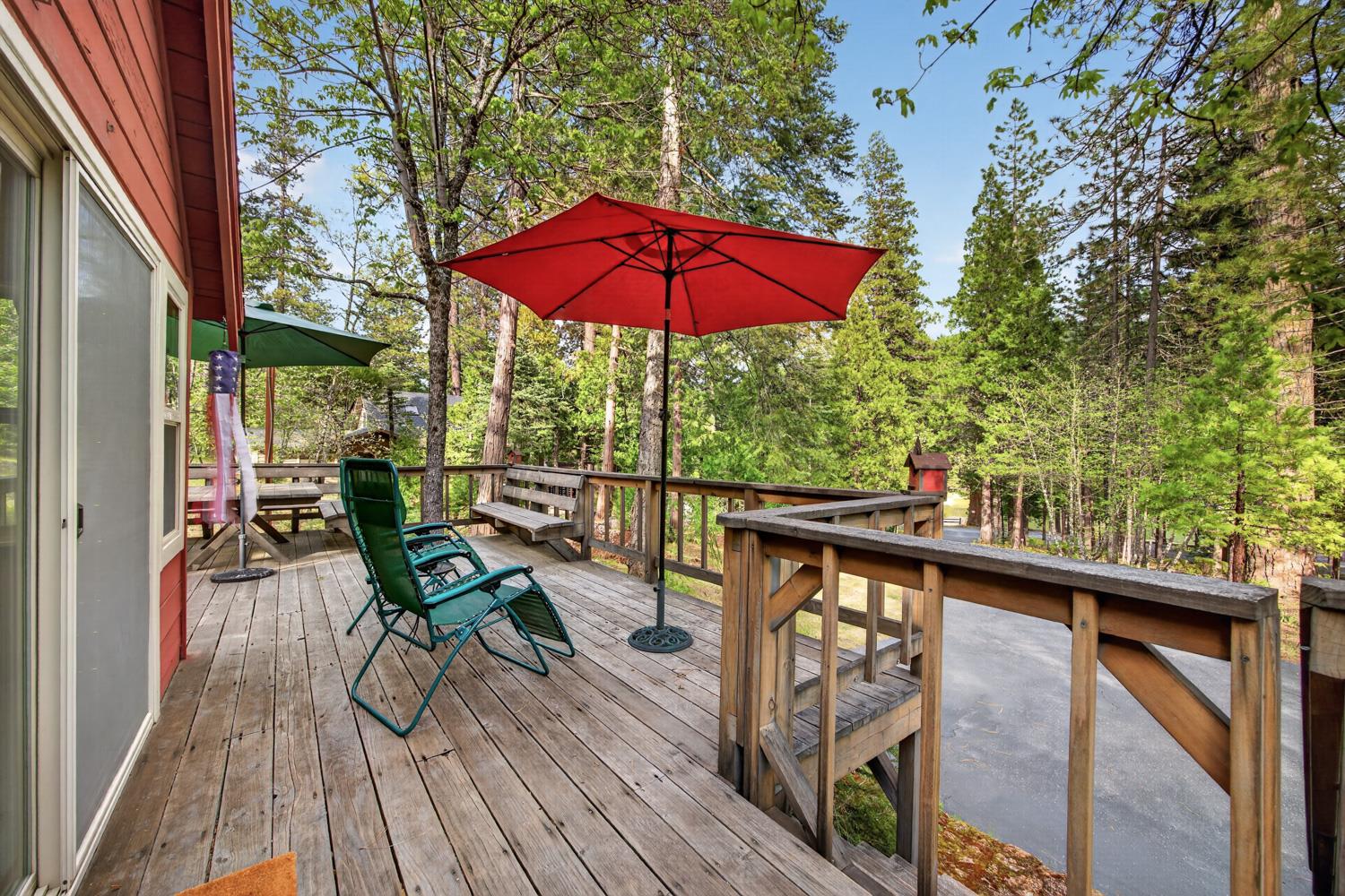 1224 Moran Road Arnold, CA 95223 - Photo 4 of 61 a view of a balcony with chairs and wooden floor
