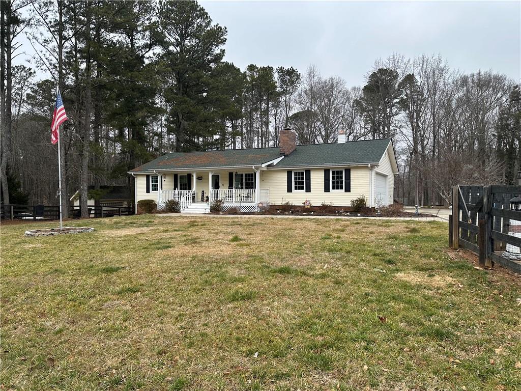a front view of a house with a yard table and chairs