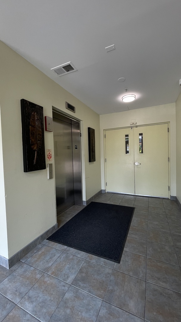 3522 South State Street, Unit 301 Chicago, IL 60609 - Photo 18 of 21 a view of a refrigerator in kitchen and empty room