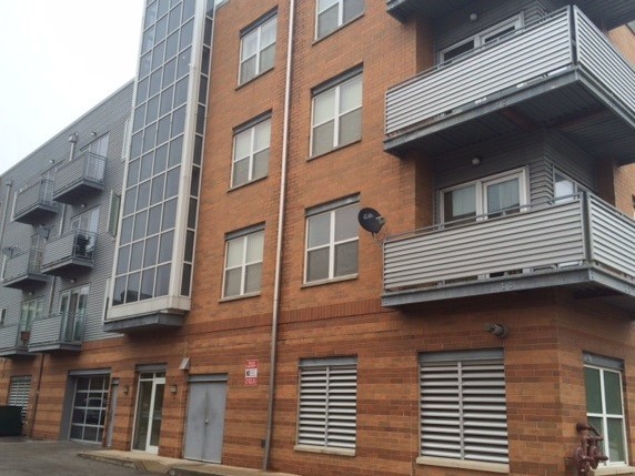 3522 South State Street, Unit 301 Chicago, IL 60609 - Photo 2 of 21 a front view of a building with a balcony