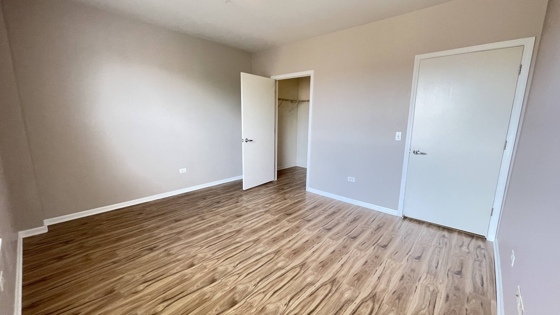 3522 South State Street, Unit 301 Chicago, IL 60609 - Photo 9 of 21 a view of an empty room with wooden floor