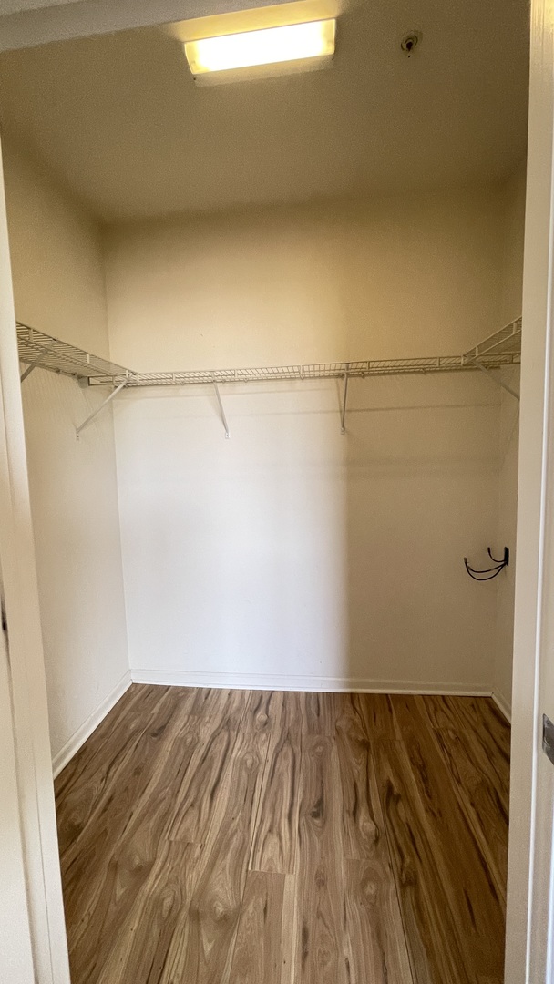 3522 South State Street, Unit 301 Chicago, IL 60609 - Photo 10 of 21 a view of a room with wooden floor