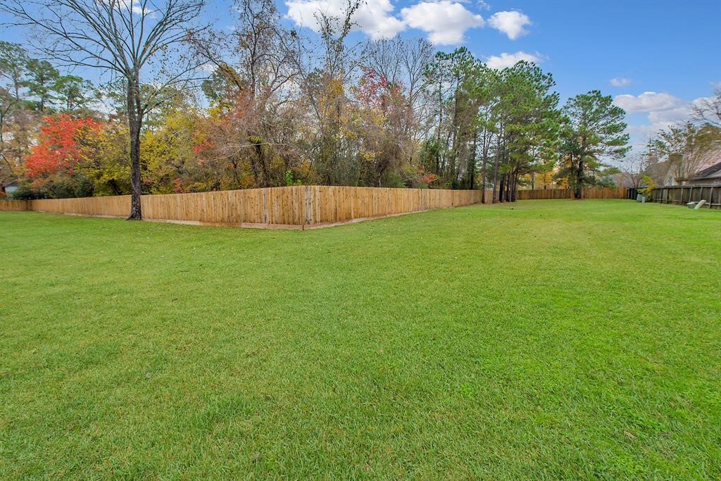 18923 Crescent Fountain Road Spring, TX 77388 - Photo 27 of 27 Nice open grassy area across the street. Enjoy a nature walk.