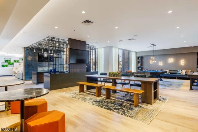 a living room filled with furniture and a wooden floor