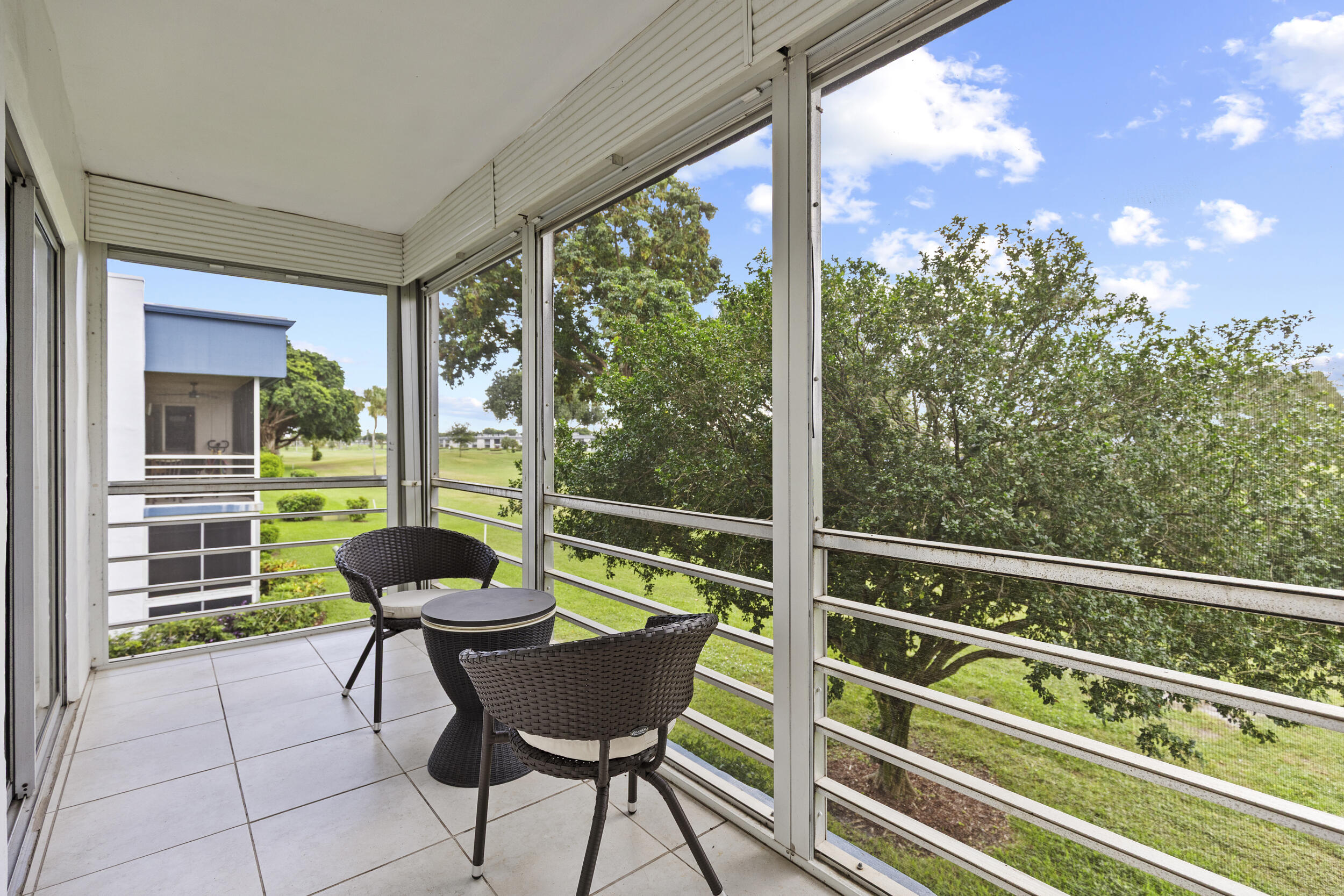 74 Normandy B Delray Beach, FL 33484 - Photo 17 of 21 a view of a chairs and table in the balcony