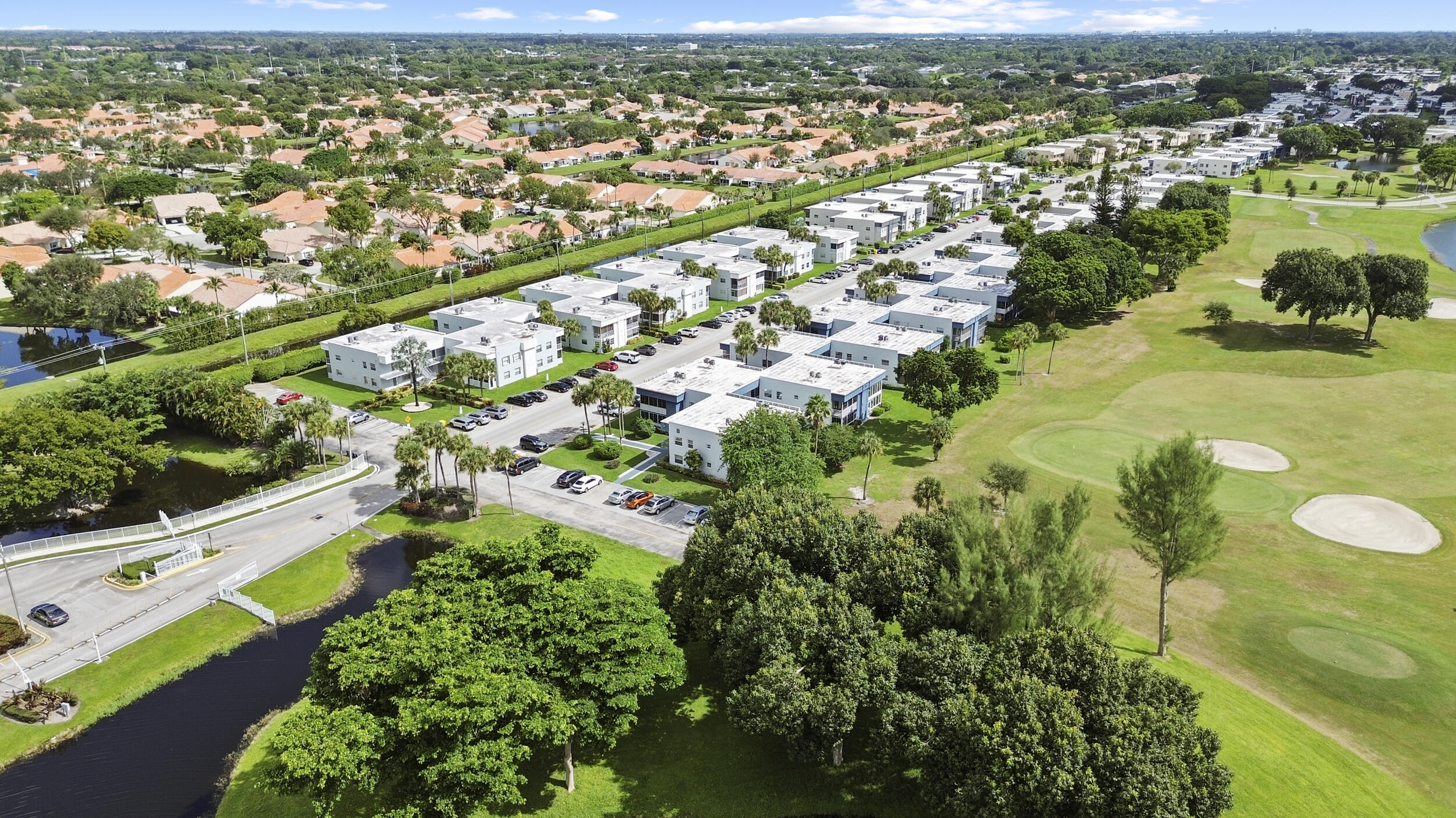 74 Normandy B Delray Beach, FL 33484 - Photo 20 of 21 an aerial view of residential houses with outdoor space