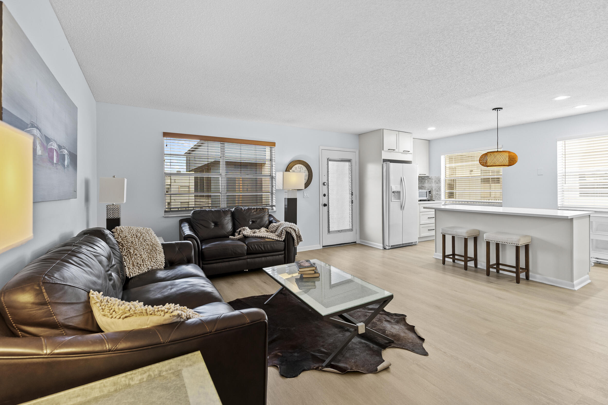 74 Normandy B Delray Beach, FL 33484 - Photo 7 of 21 a living room with furniture and a large window