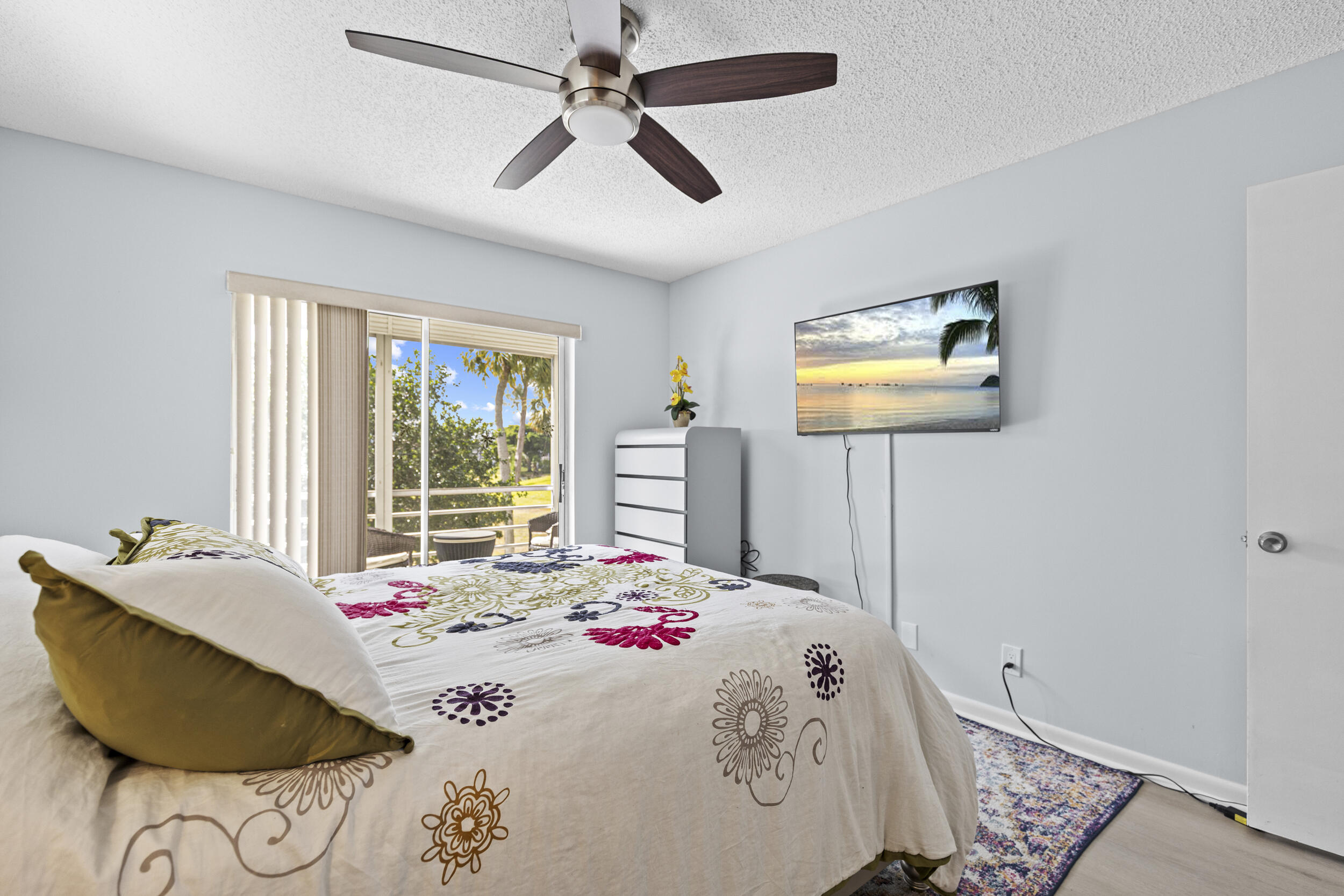74 Normandy B Delray Beach, FL 33484 - Photo 10 of 21 a bedroom with a bed and dresser