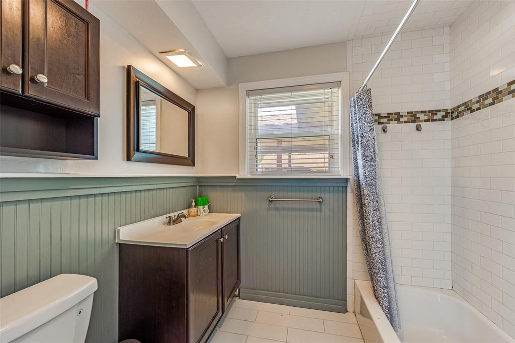 11021 Cactus Lane Dallas, TX 75238 - Photo 18 of 26 a bathroom with a sink a toilet and a shower