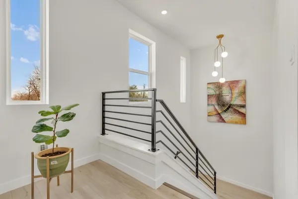 a spacious bedroom with a bed and a couch