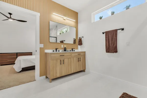 a bedroom with a bed and window