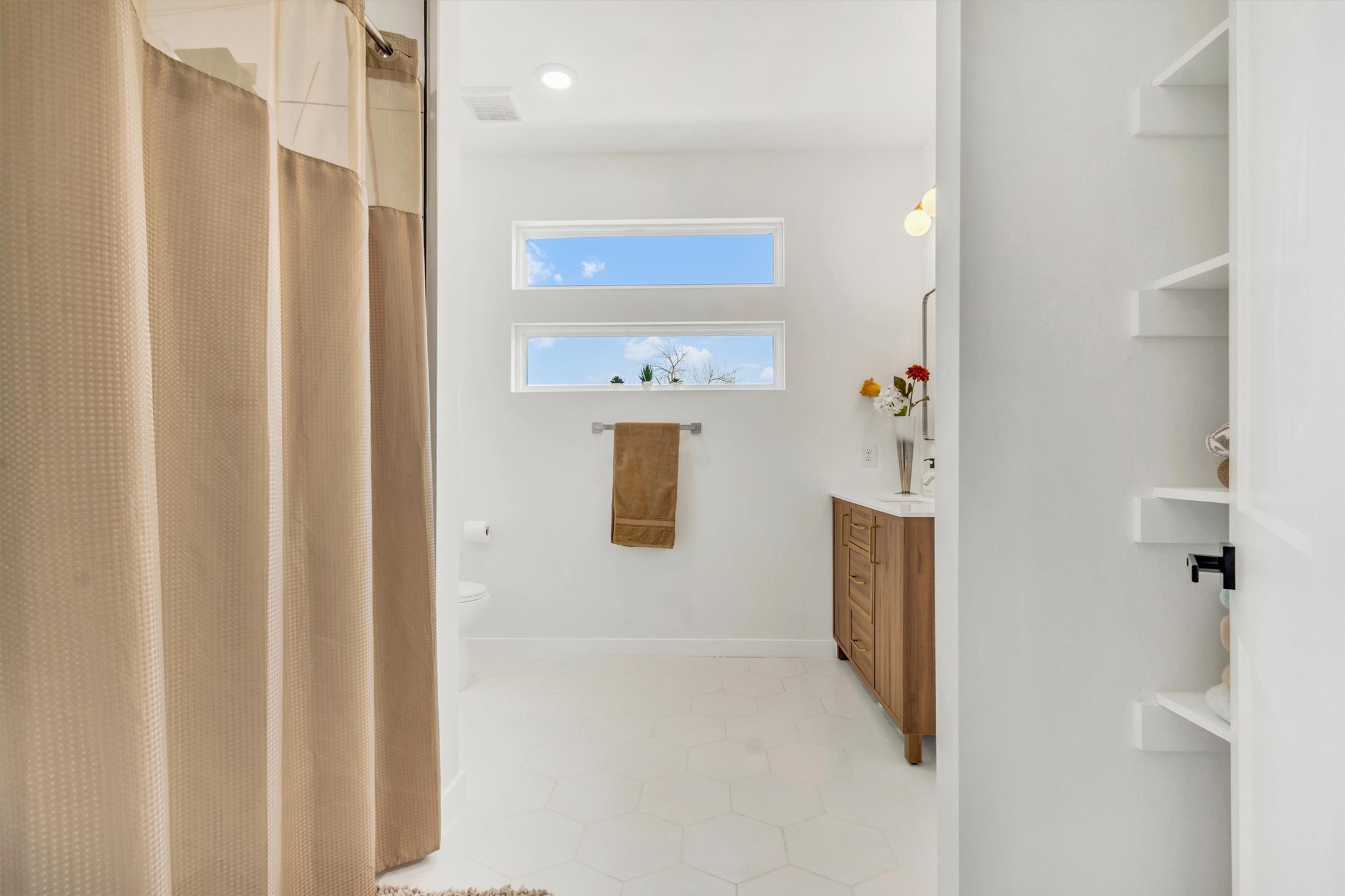 2307 Lathan Lane Taylor, TX 76574 - Photo 17 of 22 a bathroom with a shower and a mirror