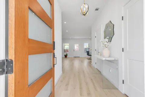 a view of a entryway door of the room