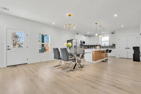 a view of a livingroom with furniture and a flat screen tv