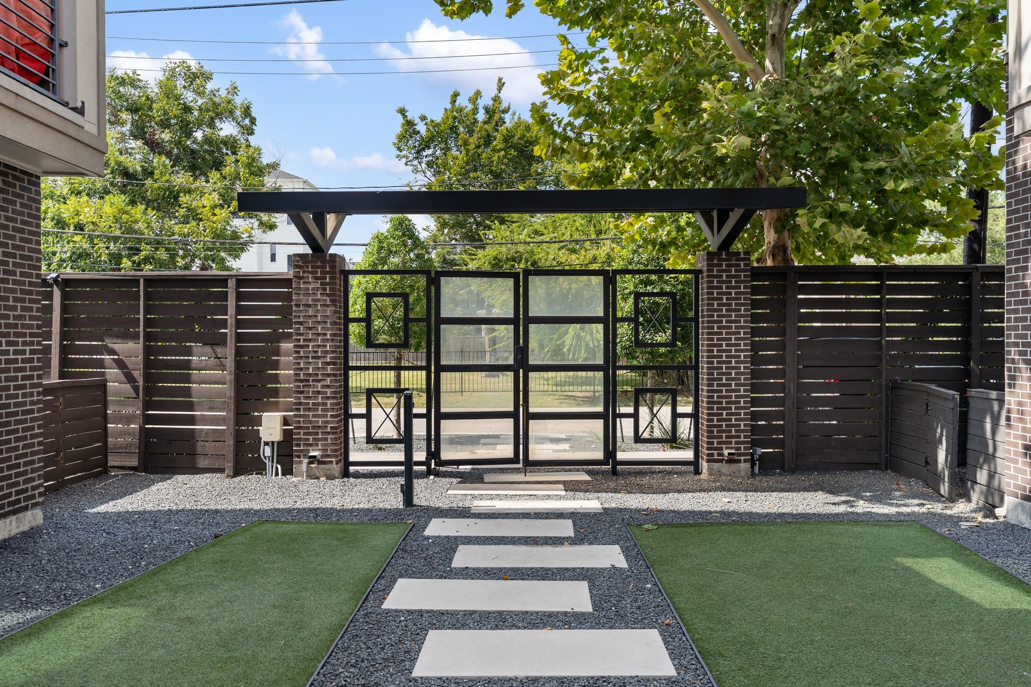 4219 Allen Street Houston, TX 77007 - Photo 24 of 29 Gated courtyard maintained by HOA as well as additional guest parking is available in front, making hosting effortless.