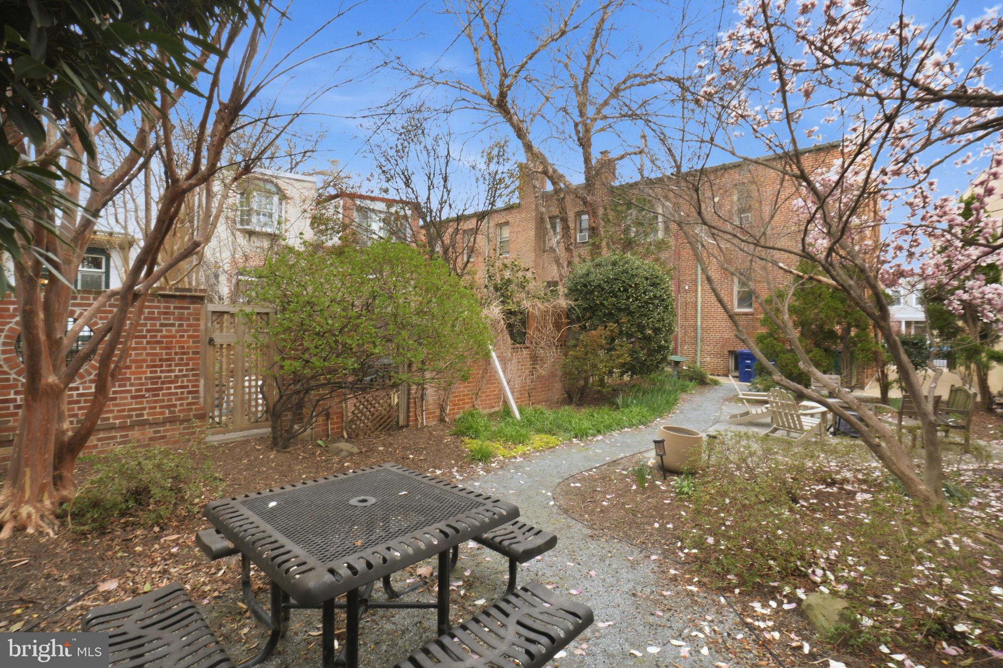 105 6th Street Southeast, Unit 108 Washington, DC 20003 - Photo 20 of 21 a view of backyard with wooden fence