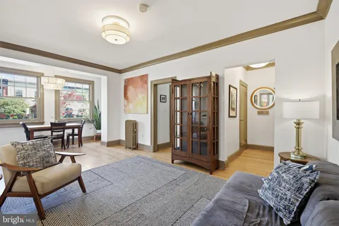 a spacious bedroom with a bed a table and chair