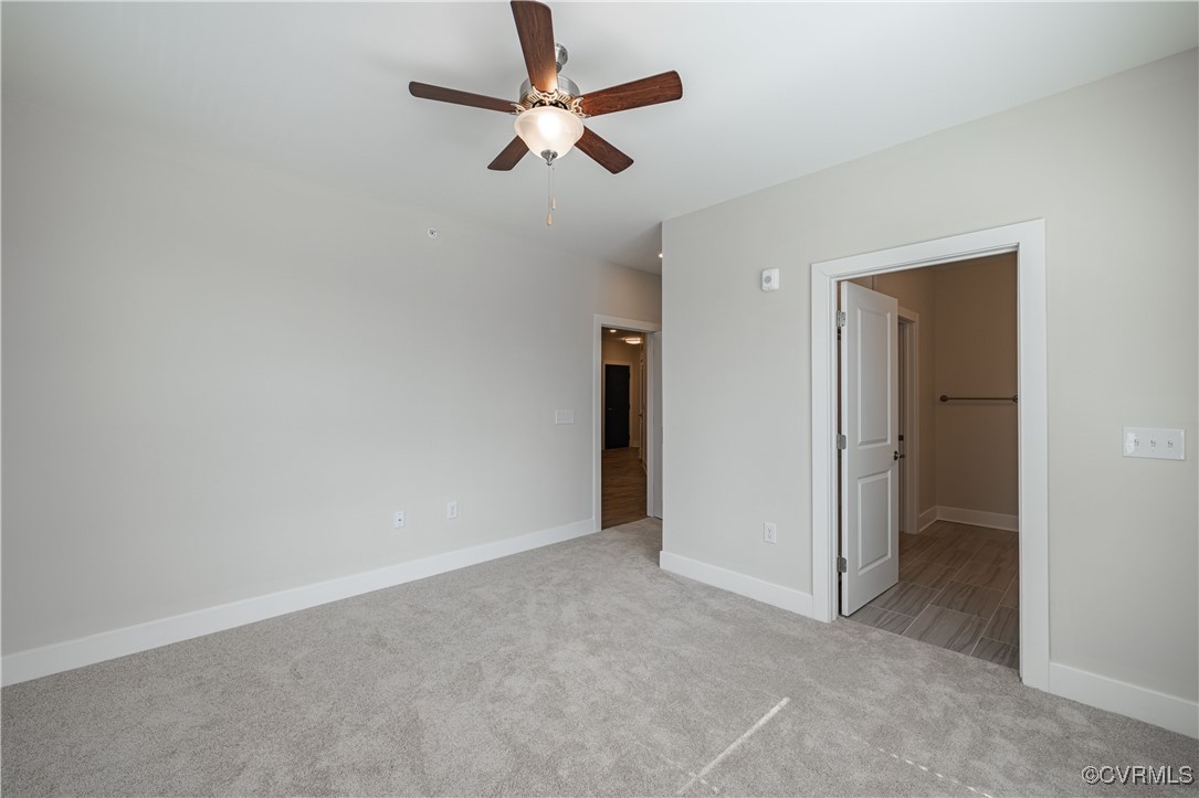 10525 Stony Blf Drive, Unit 207 Ashland, VA 23005 - Photo 19 of 19 Unfurnished bedroom featuring carpet flooring, bas