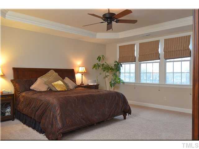 3611 Forward Way Raleigh, NC 27614 - Photo 10 of 25 Large master bedroom with trey ceiling provides plenty of room for a king-size bed, dresser, two bedside tables and a large armoire, plus a large walk-in closet
