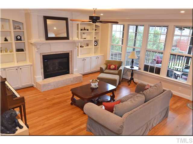 3611 Forward Way Raleigh, NC 27614 - Photo 4 of 25 Large family room with lots of natural light. The gas fireplace has unique pedestal accents and a lovely stone hearth