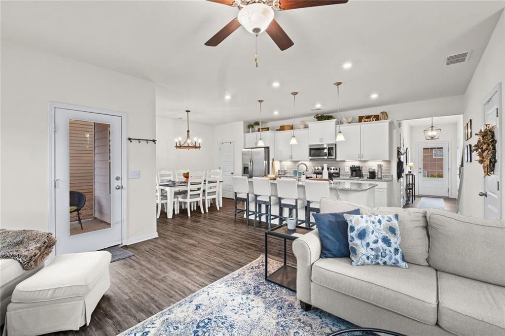 252 Renford Road Ball Ground, GA 30107 - Photo 14 of 36 a living room with furniture and kitchen view