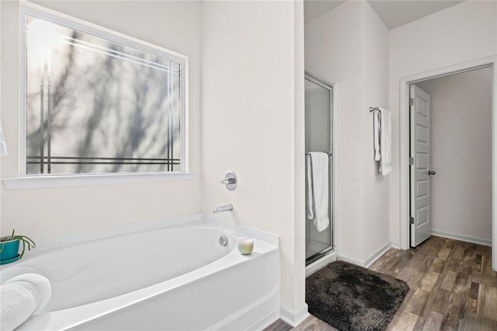 252 Renford Road Ball Ground, GA 30107 - Photo 19 of 36 a bathroom with a tub shower and a sink